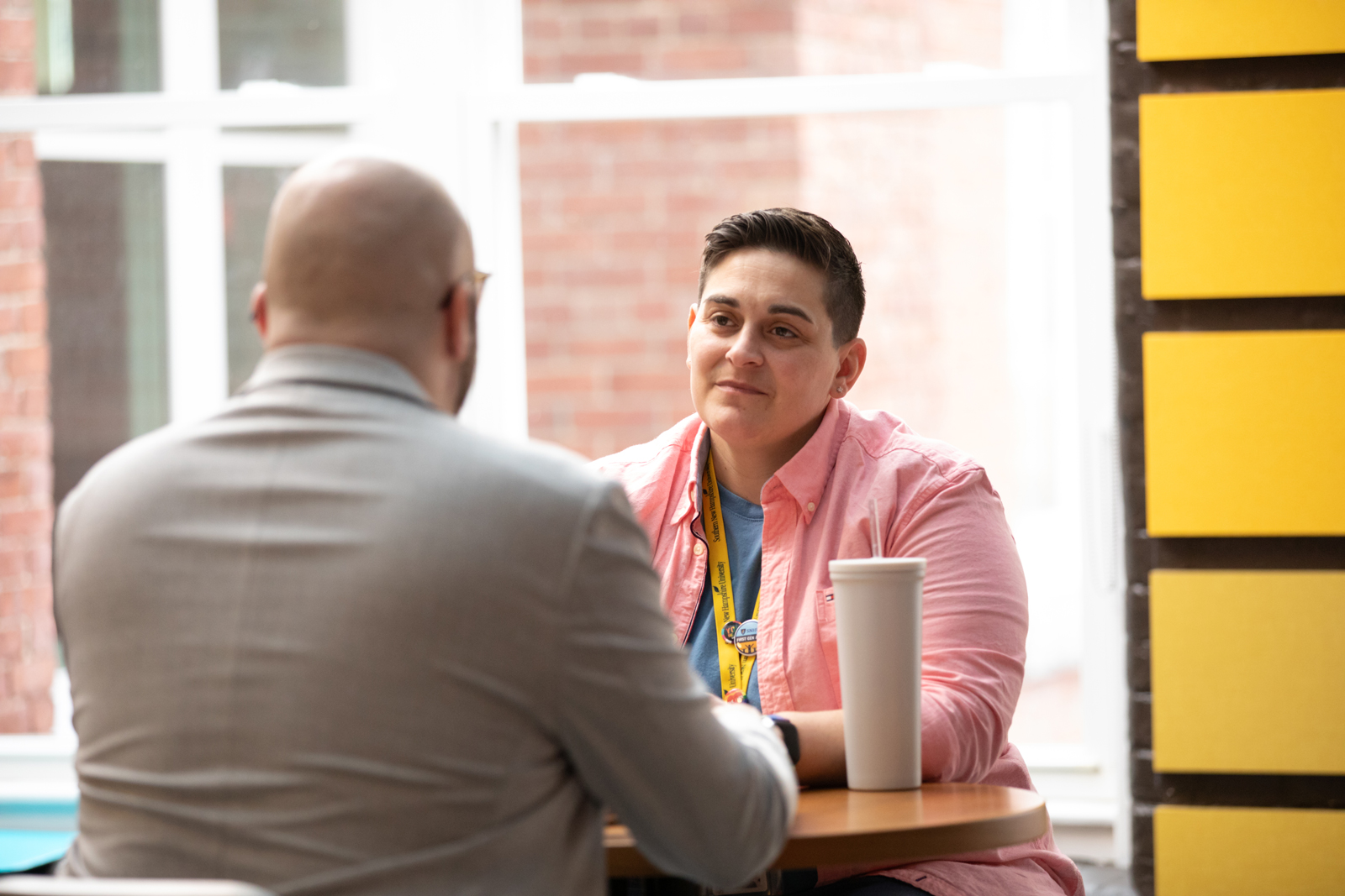 a man and woman sitting at a table