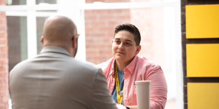 a man and woman sitting at a table