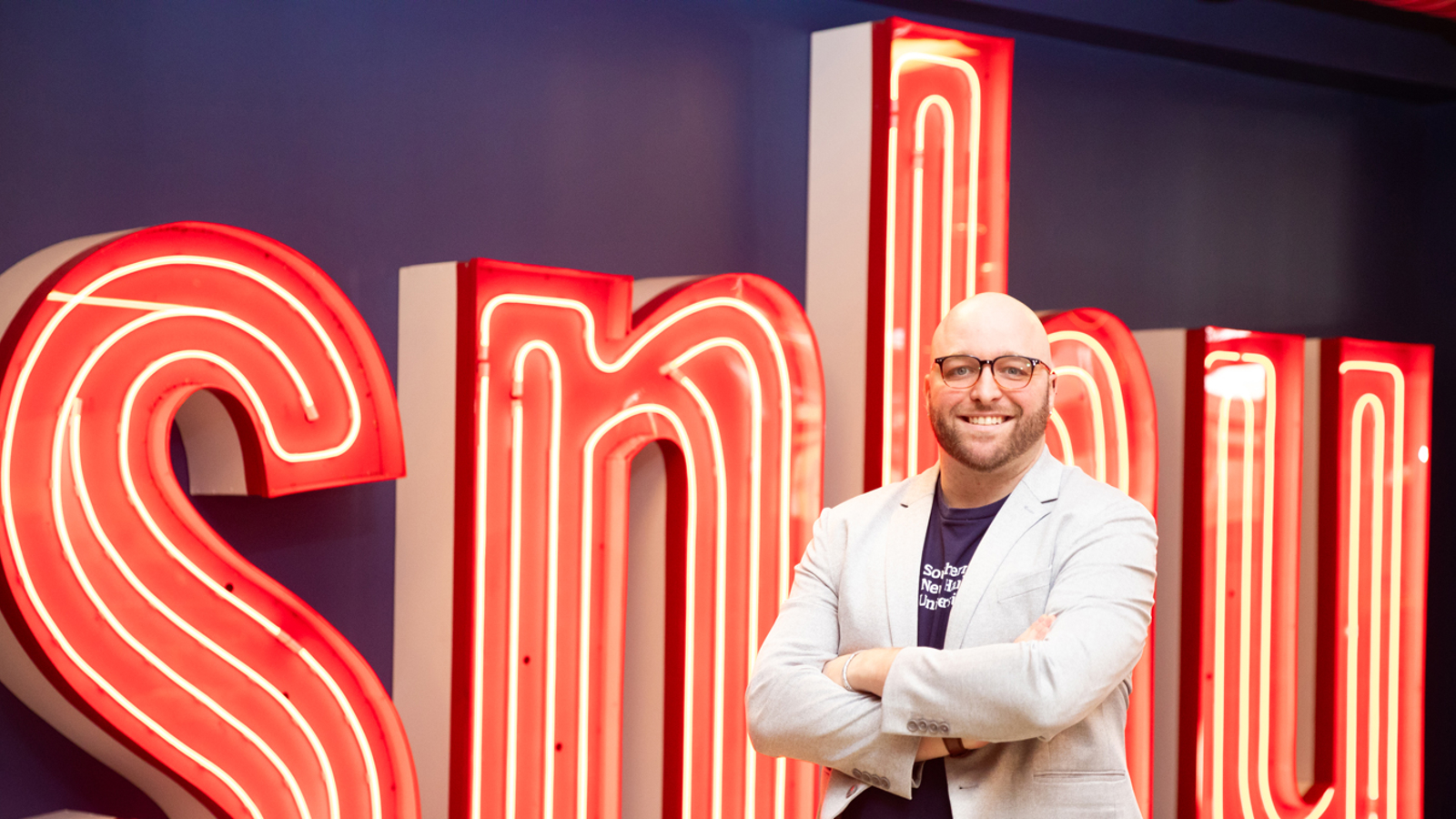 a man standing in front of a sign