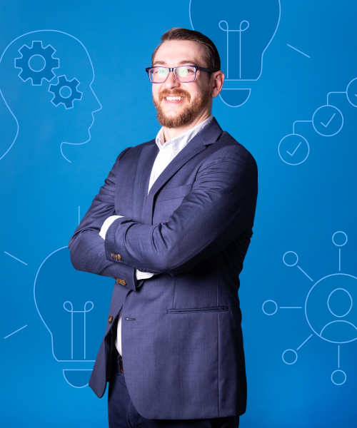 a man in a suit with his arms crossed