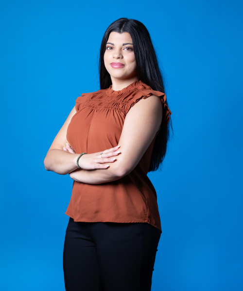 a woman with her arms crossed