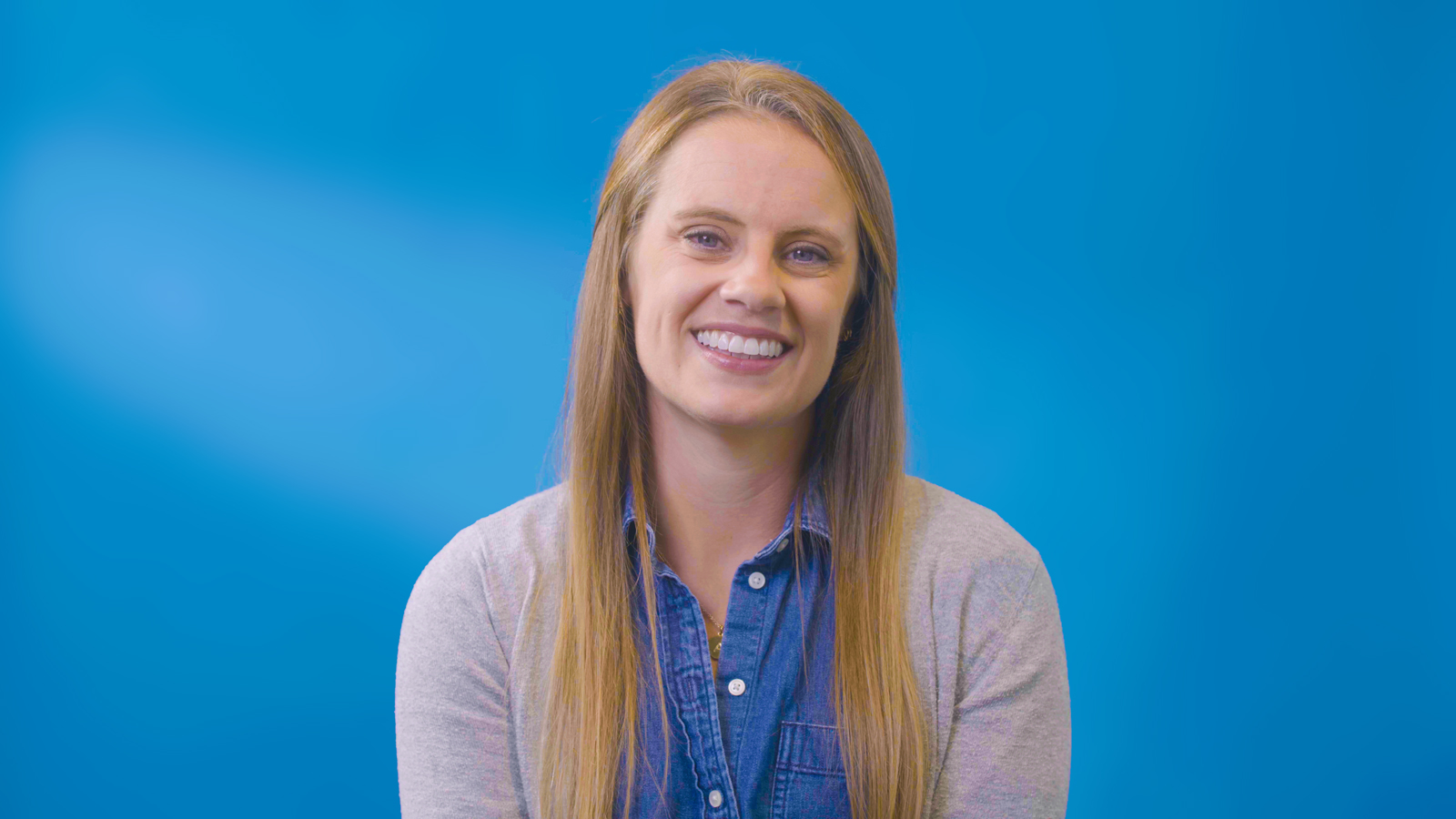 a woman smiling at camera