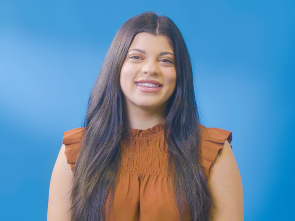 a woman with long hair smiling