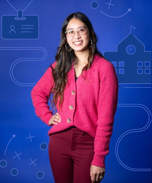 a woman in a pink sweater