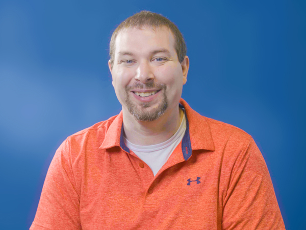 a man in an orange shirt